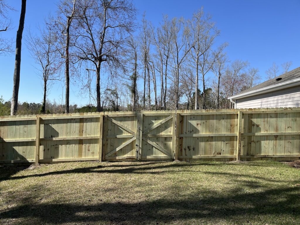 Natural wood fence installation in residential setting